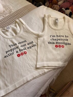 Two Old Navy tank tops printed for BTS ARIRANG.